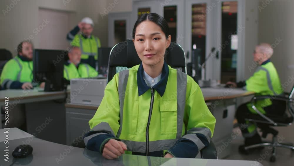 Portrait of asian woman engineer in uniform having video conference working in office Portrait of asian woman engineer in uniform having video conference working in office