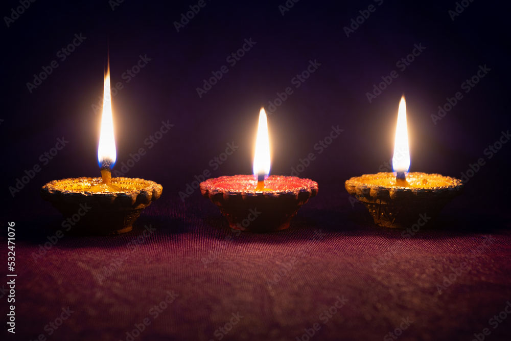 Clay diya lamps lit during diwali celebration. Indian festival diwali Clay diya lamps lit during diwali celebration. Indian festival diwali