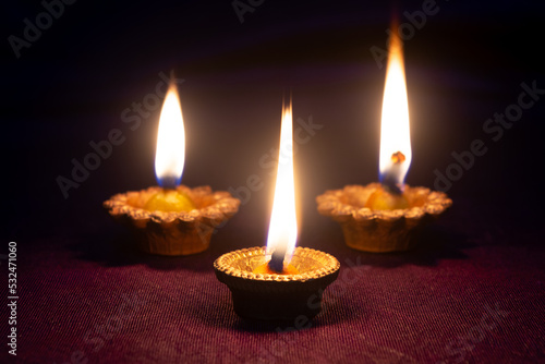 Clay diya lamps lit during diwali celebration. Indian festival diwali