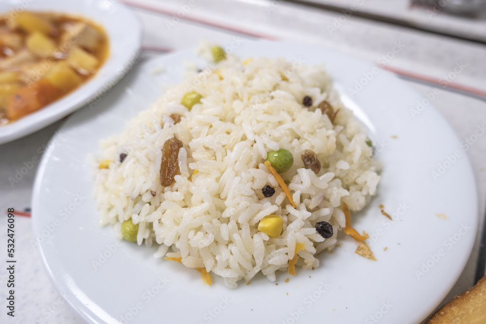 Delicious rice with garniture, raisins pea and sweet corn in rice, dinner and meal idea, eating Turkish food, top view of pilaff, selective focus Delicious rice with garniture, raisins pea and sweet corn in rice, dinner and meal idea, eating Turkish food, top view of pilaff, selective focus