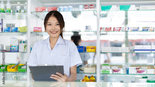 Pharmacist working in a pharmacy, Consultation and medical advice, All kinds of generic household drugs and pharmaceutical products on the shelf, Service and assistance to patients, Pharmacy. Free Download Pharmacist working in a pharmacy, Consultation and medical advice, All kinds of generic household drugs and pharmaceutical products on the shelf, Service and assistance to patients, Pharmacy. - GFXLoad