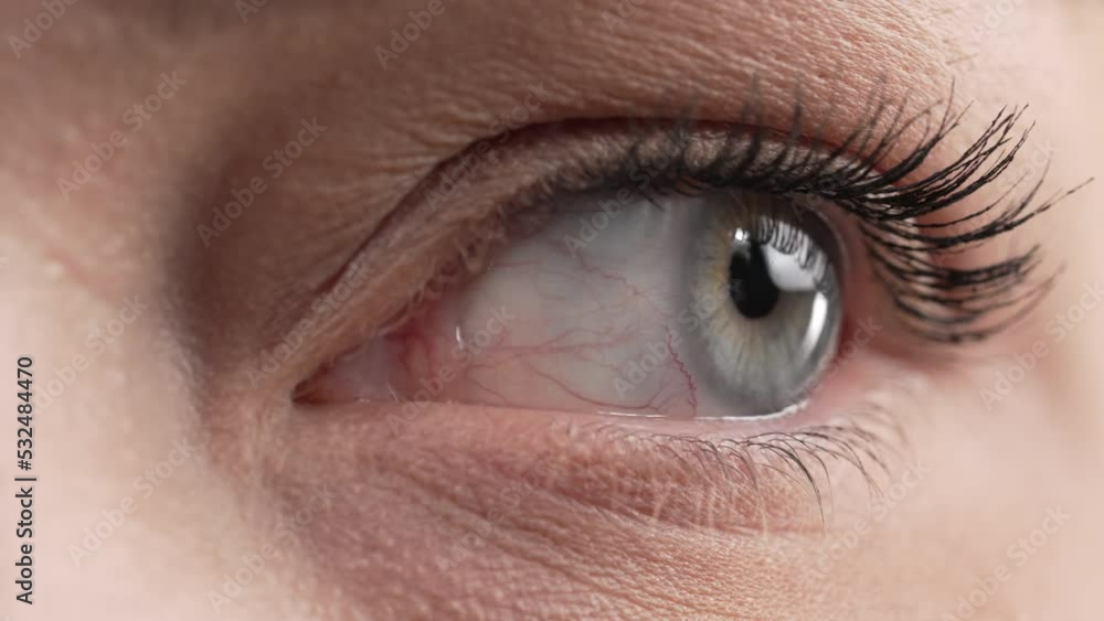 Close-up of a caucasian woman with blue eyes looking up, down and around. Close-up of a caucasian woman with blue eyes looking up, down and around.