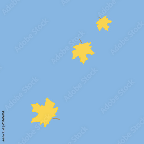 Autumn concept. Yellow leaves on a blue background.