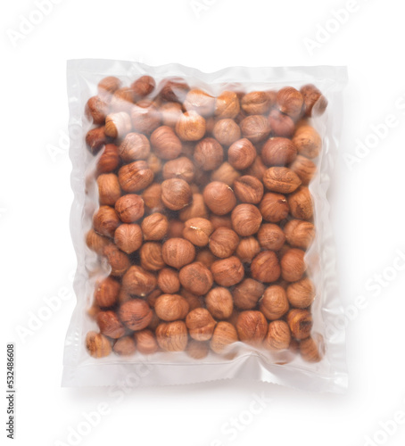 Top view of shelled hazelnuts in transparent plastic bag