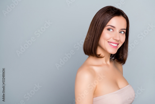 Photo of joyful lady look empty space new spa salon opening advert isolated over grey color background