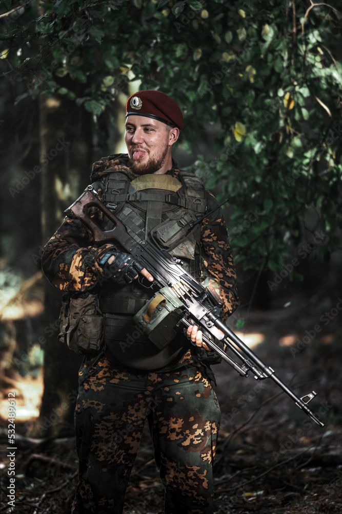 Obraz premium Portrait of an eastern special forces soldier with rifle