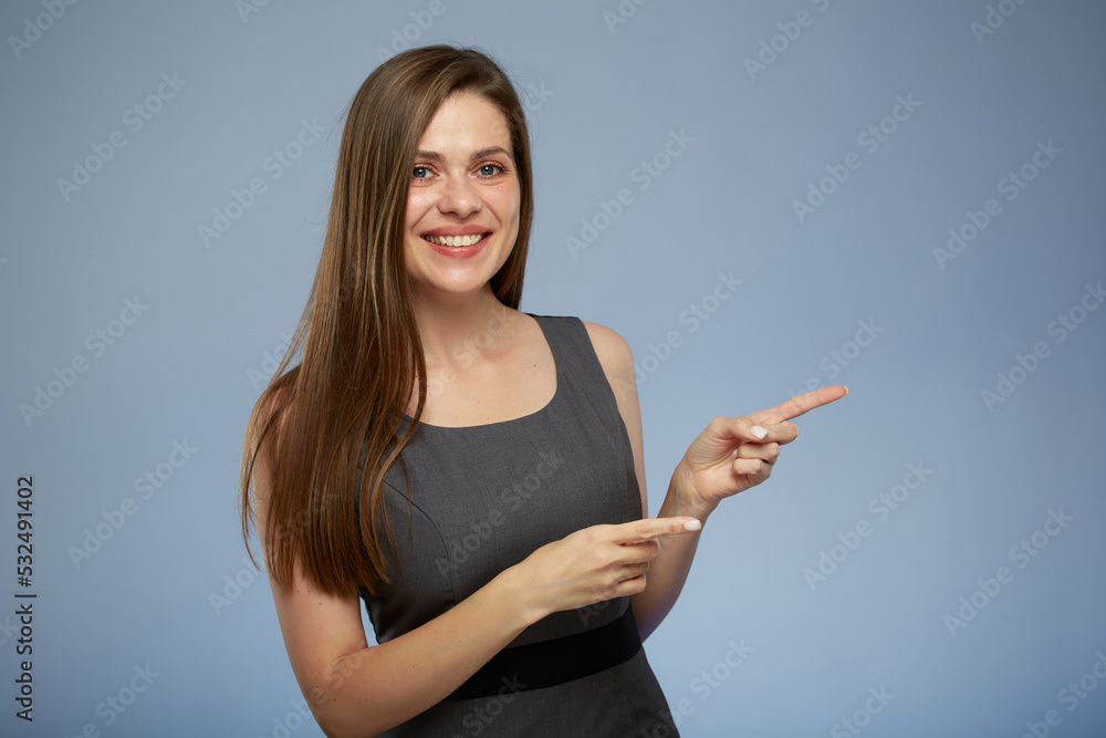 Smiling business woman pointing with two fingers side away at copy space. isolated portrait. Smiling business woman pointing with two fingers side away at copy space. isolated portrait.