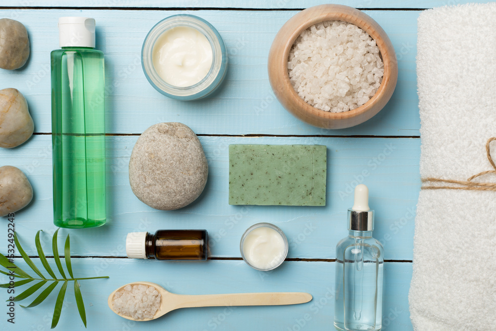 Composition with spa products on wooden background, top view Composition with spa products on wooden background, top view