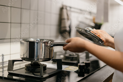 Asian woman is cooking in the kitchen