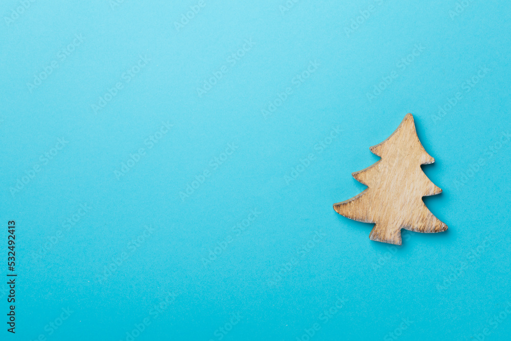 Wooden Christmas tree on color background, top view Wooden Christmas tree on color background, top view