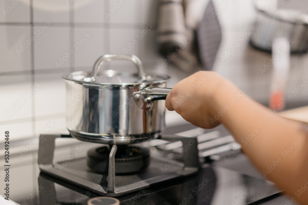 Asian woman is cooking in the kitchen Asian woman is cooking in the kitchen