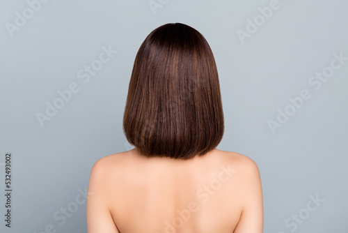 Back view photo of slim beautiful naked shoulders girl haircare keratin straightening isolated on grey color background