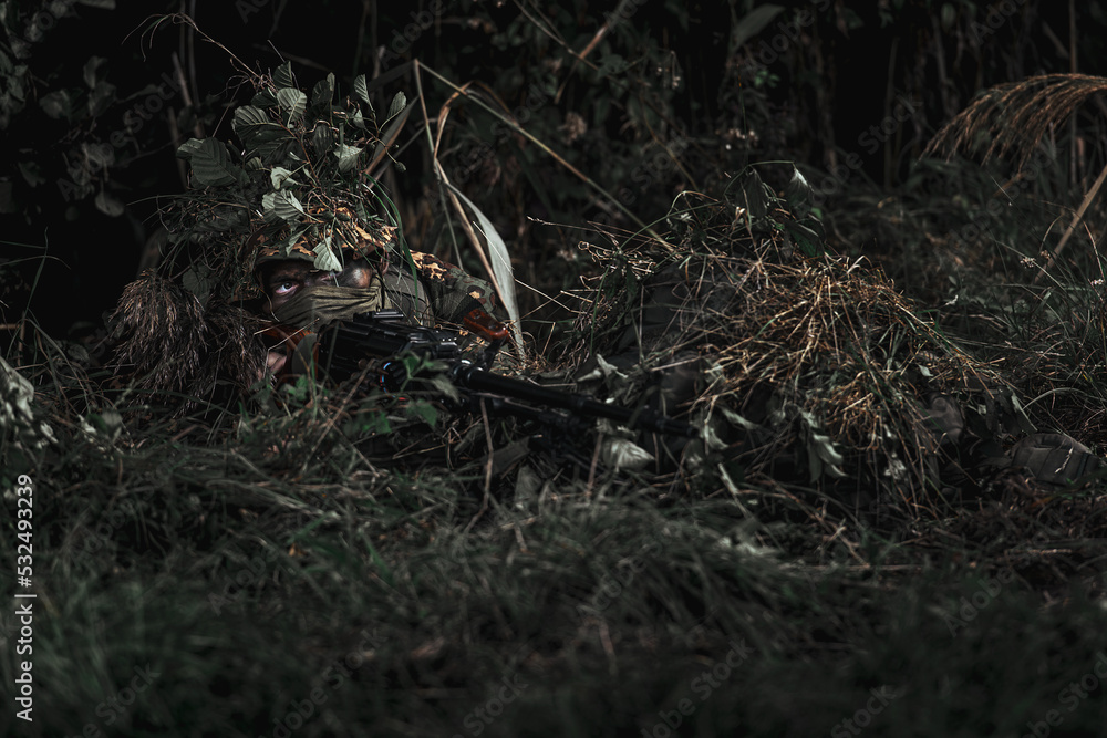 Eastern special forces soldier with rifle in woodland Eastern special forces soldier with rifle in woodland