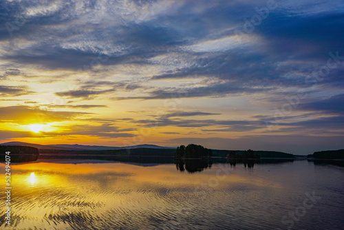 sunset over the Ural lake © Алексей Рязанов
