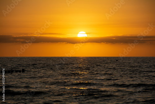 Beautiful orange sunset over the sea © Claudia Evans 