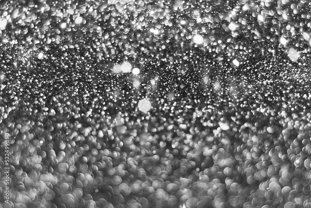 Gray silver sparkling glitter bokeh background, christmas abstract defocused texture. Holiday lights. Snowy shiny sparkle stars for celebrate Gray silver sparkling glitter bokeh background, christmas abstract defocused texture. Holiday lights. Snowy shiny sparkle stars for celebrate