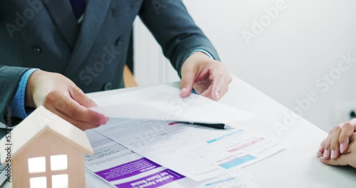 Businessman, saleman or agent to read, explain or review detail in document, agreement, contract for sale, rent, buy of home, house or residential building. Concept of business, real estate, property. photo