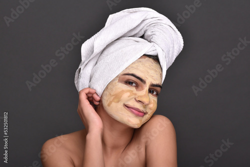 A young woman's face with home made face mask applied for skin care 