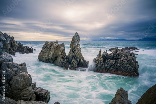 The rocky coastline of Walker Bay at De Kelders near Gansbaai in the Overberg, Western Cape. South Africa photo