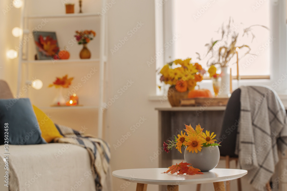 beautiful autumnal bouquet with flowers and leaves at home - obrazy, fototapety, plakaty 