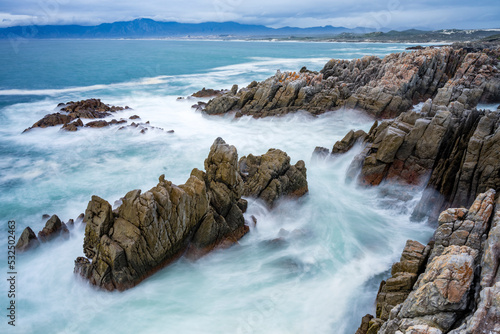 The rocky coastline of Walker Bay at De Kelders near Gansbaai in the Overberg, Western Cape. South Africa photo