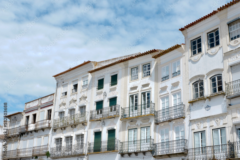 Authentic classical buildings with vintage facades downtown in Evora, Portugal