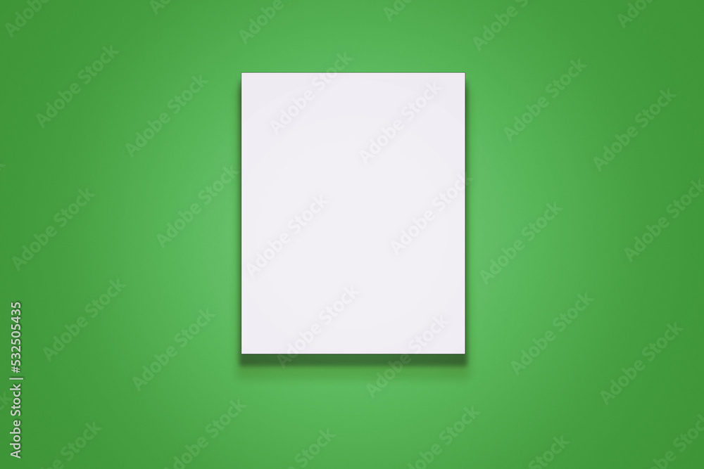 Vertical white blank poster with portrait orientation hanging on green wall front view Vertical white blank poster with portrait orientation hanging on green wall front view