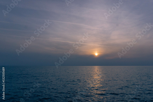 Nice sunset with clouds in the sea