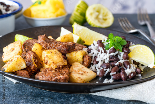 Canvas Print Jerk pork and pineapple with black bean rice