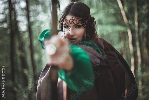 Konstfotografi beautiful elf girl archer in a forest