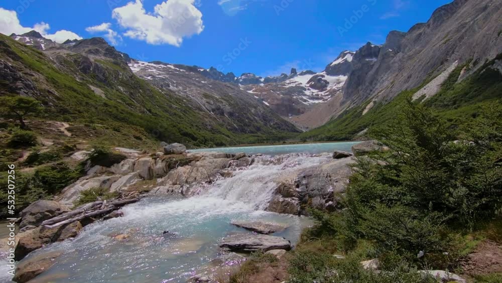 Waterfall Laguna Esmeralda in summer season in Ushuaia, Patagonia Waterfall Laguna Esmeralda in summer season in Ushuaia, Patagonia