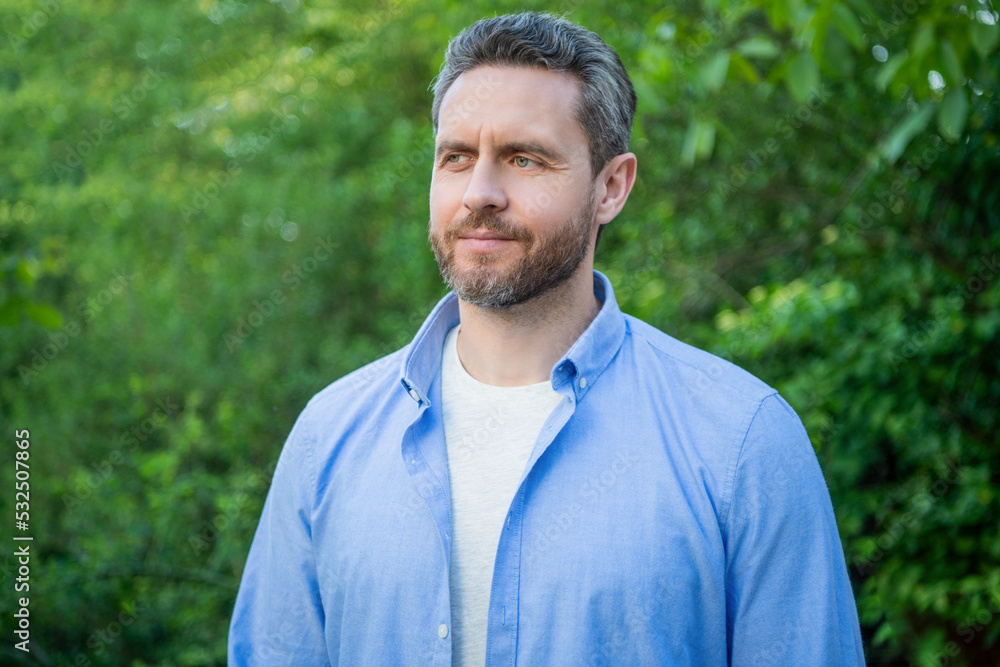Portrait of handsome professional guy in blue shirt natural background Portrait of handsome professional guy in blue shirt natural background