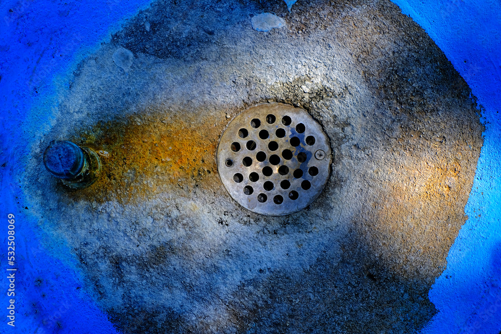 Drain in Circle of Blue with Stains Drain in Circle of Blue with Stains