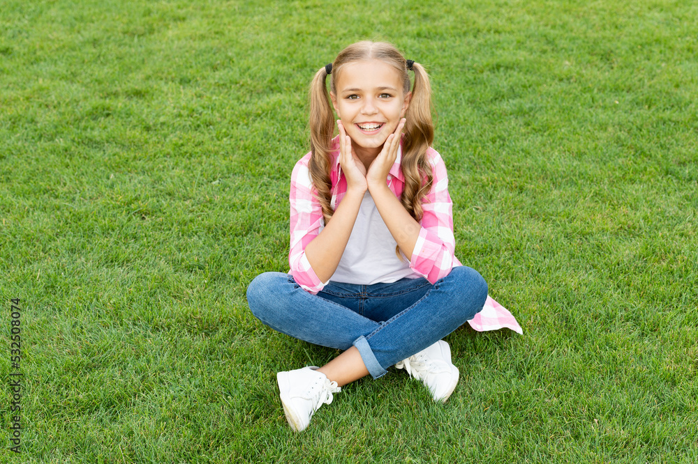 happy teen child sit on green grass outdoor happy teen child sit on green grass outdoor