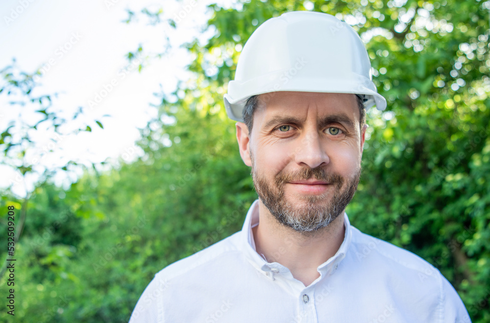 Portrait of man architect wearing hardhat outdoors natural background, copy space Portrait of man architect wearing hardhat outdoors natural background, copy space