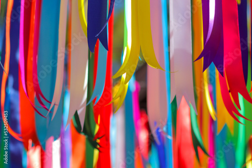 multi colored ribbon backdrops are hung to represent lgbtq community to call for queer equality and rainbow backdrop formed by multi colored ribbons and Copy Space for messages. LGBT concept