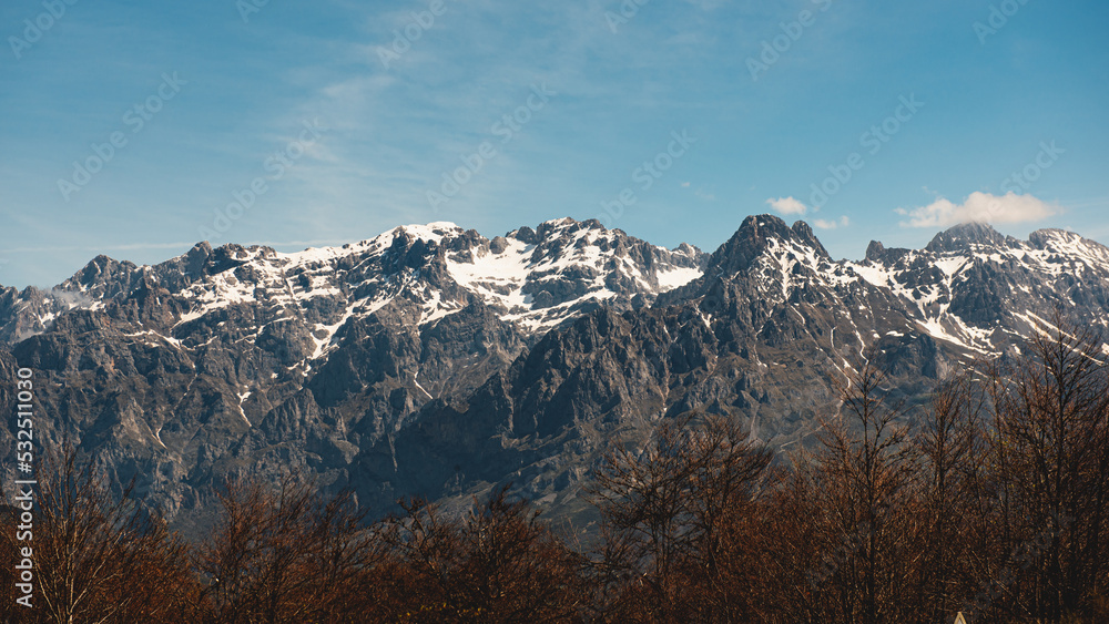 panoramic view of the central massif of the picos de europa national park, spain. landscape of snowy mountains on a clear day