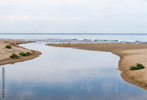 River mouth flowing into the sea.