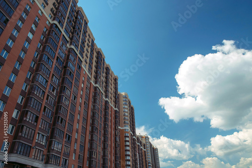 Multi-storey building on a background of blue sky © grthirteen