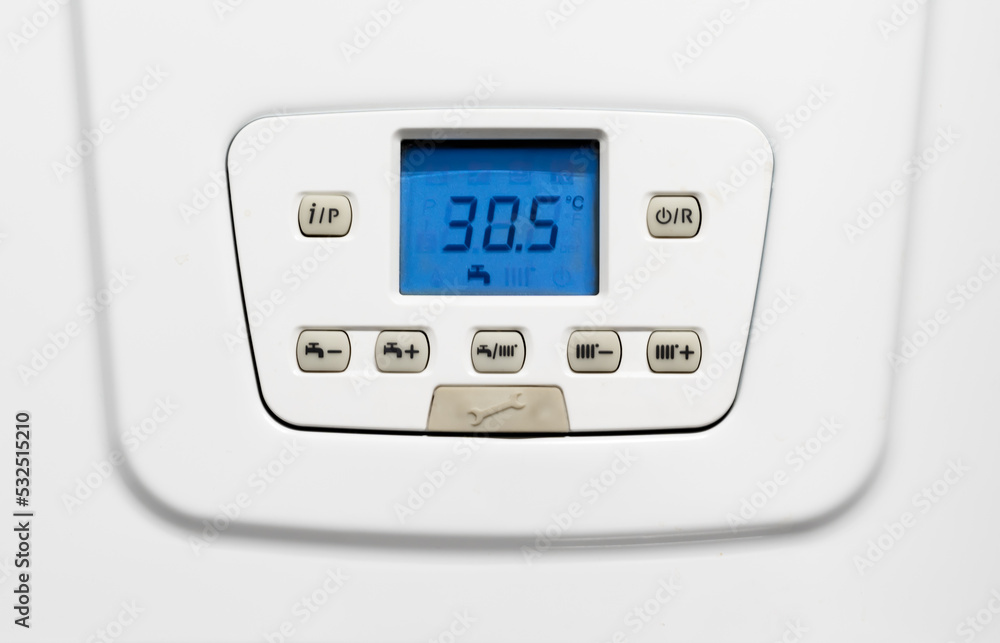 Close-up view of the bright blue display to regulate the water degrees of a wall-mounted gas boiler Close-up view of the bright blue display to regulate the water degrees of a wall-mounted gas boiler