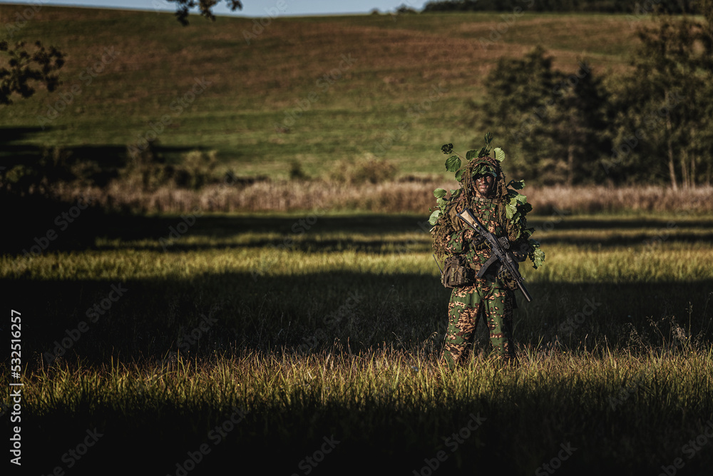 Eastern special forces soldier with rifle in woodland Stock Photo ...