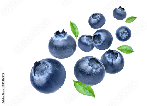 Blueberries with leaves levitate isolated on a white background.