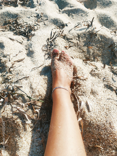 Woman's foot on the beach