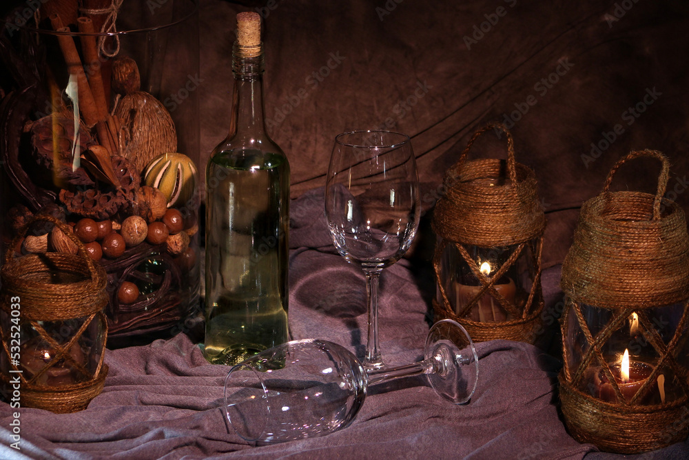 Vintage naturmort with bottle of wine and candles. Still life photography.