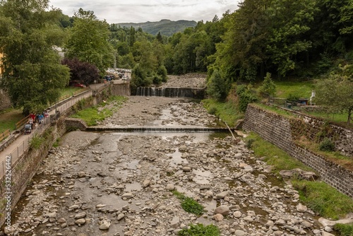 Mountain village with river and vegetation