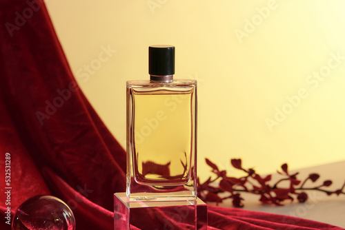 Female perfume with red flowers photo