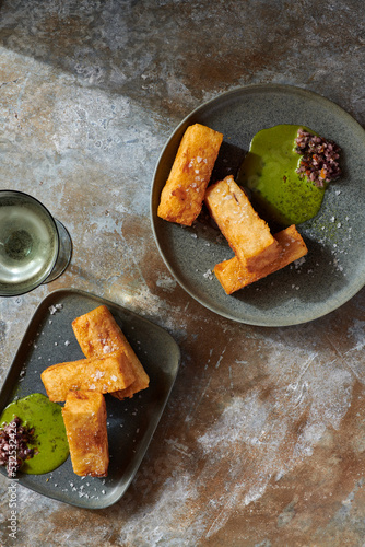 Yucca Fritas with Green Sauce and botija olive escabeche photo