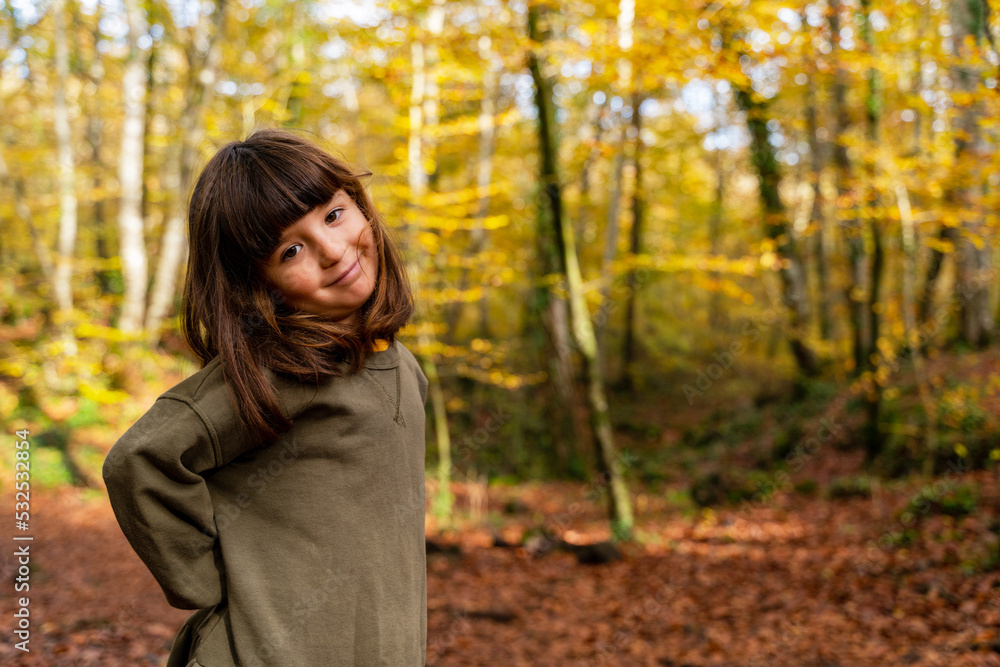 Little girl playing in autumn forest Little girl playing in autumn forest