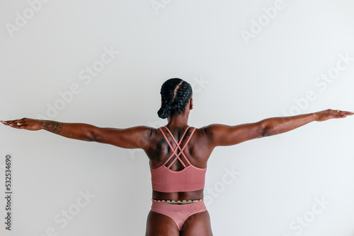 Athletic woman wearing bra and thong