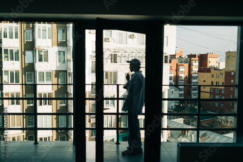 Androgyne person on the balcony photo